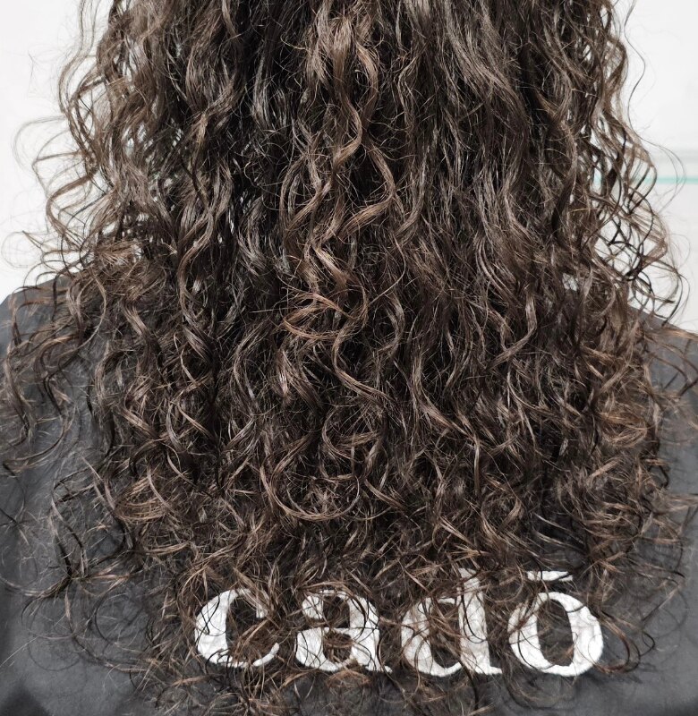 Defined brunette curls and natural texture by Riverside Hair